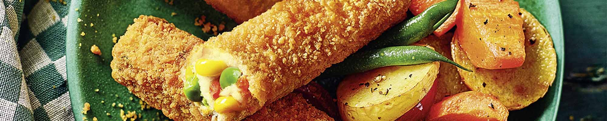 Green Cuisine Gemüsestäbchen angerichtet auf einem Teller